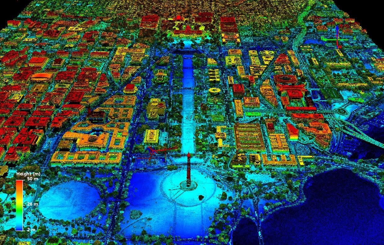 Multicolored 3-d map of a city next to water.